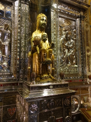 The Black Madonna (Virgin of Montserrat) depicting the Virgin Mary in the alcove above the altar.