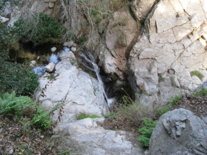 Top of the falls after a steep run/hike up the trail.
