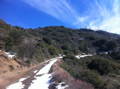 Looking towards the top from the truck trail. The single track picks up again just off the road. The snow is melting fast in the exposed areas, but as soon as you drop back into the shady trees, it gets pretty deep.