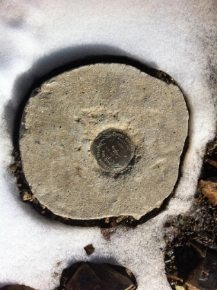 The official summit marker, with a touch of snow.