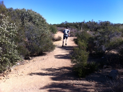 As I headed back down, I passed my Dad somewhere above Four Corners. Here's his picture of me running off.