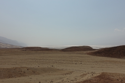 It almost looks like a tractor has smoothed the ground and formed huge dirt piles, but it's the result of floods.