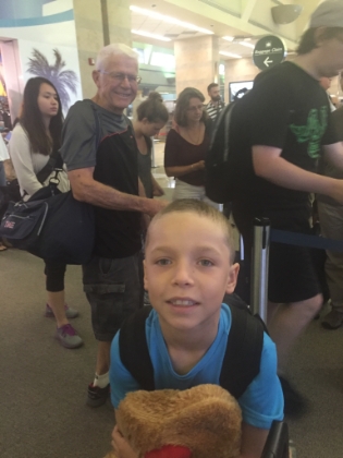 Ready to leave from John Wayne airport with stuffed dog in-hand.