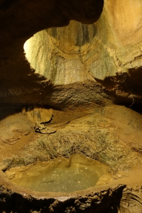 The wishing well. Water drips from somewhere high up above into this little pool. They use it to take donations for local charities.