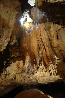 You can mostly just see the lower tier of the falls as the upper tier is in the cavern above.