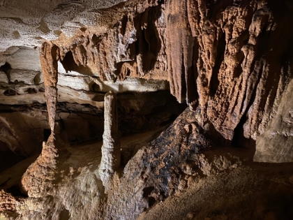 The black coloring on the rock is actually soot that filtered down into the cave from when the visitor center was burned to the ground by a rival cave owner during the "Kentucky Cave Wars".