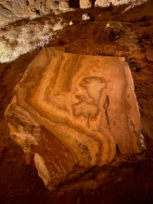 A section of stalactite that has been cut and polished to show the cross section.