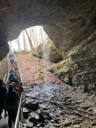The waterfall flowing over the entrance to the cave.