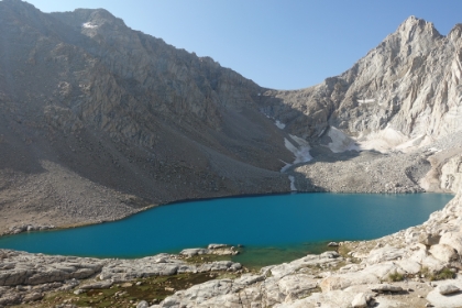 Full view of Consultation Lake, a brilliant turquoise in the bright late morning sun.