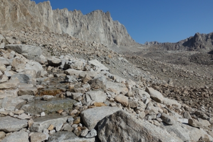The rough, rugged steps make for slower going here. And there's water flowing like a river down the steps in several places. It must have really been raining hard up here recently. But there's still not a single cloud in the sky.