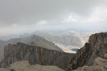 One last summit view. The thunder is starting to sound close and the occasional drop of rain is getting more frequent. I've been on top for about 20 minutes, and I decide it's time to head down right at noon.