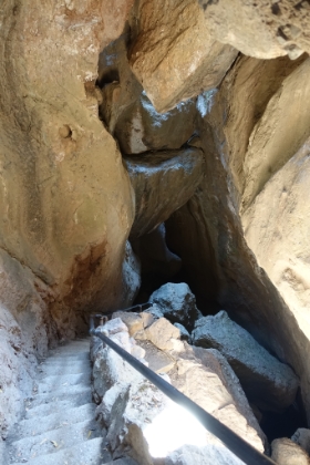 Climbing up and out of one area of the cave.