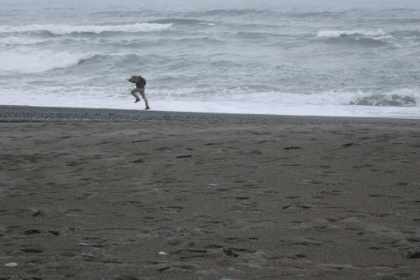 Made it to the water. And unintentionally into the water. Dad gets this photo as a wave catches me by surprise while trying to take a photo.