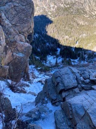 Heading back now and looking down the ice cliff alongside Timberline Falls. How the @!&?# am I going to get down that!?