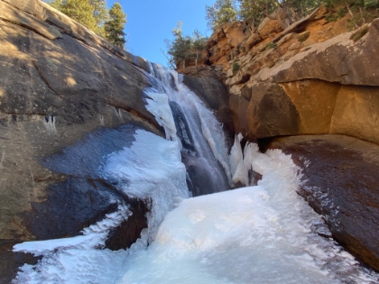 It's a fascinating effect as the stream flows over the waterfall, into a hole in the ice, and then continues downhill under the ice.