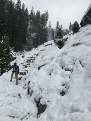 Needless to say, we press on... Here we arrive at the first view of Vernal Fall on the Mist Trail and the start of of the steps to the top. With the slippery steps, and steep dropoffs, this section of trail is considered by many to be dangerous even during the summer. Covered by snow and ice, it definitely ranks high on the danger scale. Dad decides this is far enough, but I'm determined to at least get around the corner to get a full view of the falls. At this point, I honestly had no intent to go any further than that.