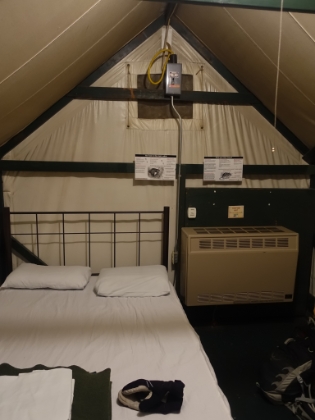 The original plan had been to drive out of the Valley before dark. But it was getting late, and it was still snowing, so we decided to try to find a place to stay for the night. We didn't have full snow camping gear with us, and the lodge was sold out, so our only option was the tent cabins near Curry Village. The only ones they had left were unheated, but at the last minute a heated one opened-up. Given that morning temps were supposed to get down to 14 degrees, we jumped at the chance. Here's our cozy tent where my Dad and I would have to share the double bed. And where "heated" was a bit of a misnomer since the doors and windows were not sealed at all.