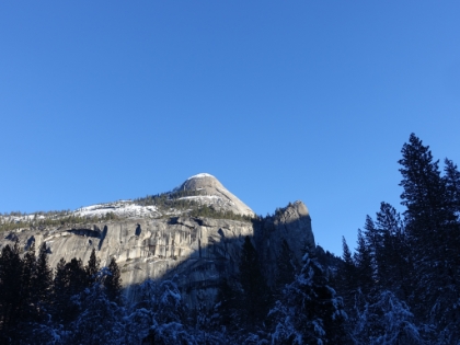 A snow-capped North Dome with Washington Column and the Royal Arches below.