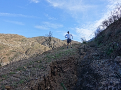 Dr. Rock coming down some heavily rain-rutted trail. He loves this stuff.