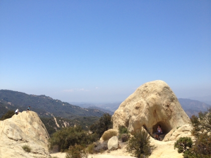 Hikers hanging out on the rocks.