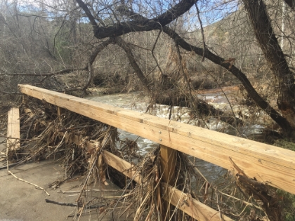The new bridge built after the last big rainy year is partially destroyed again. The water is just below bridge level. A little bit higher, and this probably would have been the end of my day.