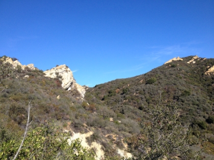 A prominent rock point almost up to the ridge.