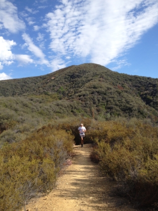 Dr. Rock with the Unknown Peak behind him.