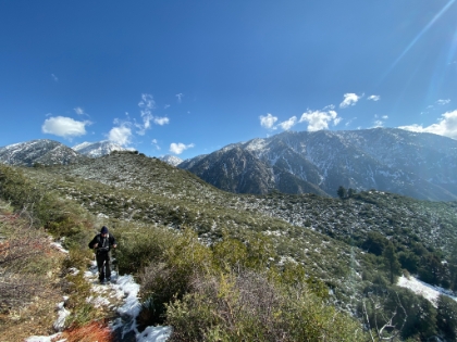Dad heading-up the switchbacks surrounded by an interesting mix of chapparal and snow.