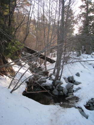 Another look at the creek cutting through the snow. The snow is getting deeper as I gain elevation. There is a deeply grooved trail all the way up to the saddle though. So no breaking the trail and no route finding. Might I actually have an easy day today? Now that's a dumb question, isn't it?