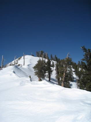 It's starting to level out now, and I'm almost there, which is a really good thing because it's getting late, and I'm dying. For the last couple of miles now, in moments when I was completely still, I swear that I heard the faintest sounds of human voices. And for the last mile or so, I have actually smelled humans. Yes, you can definitely smell the slight outhouse scent that is around popular destinations in the mountains. It's amazing how heightened your senses get when it is so quiet and so pure up here.