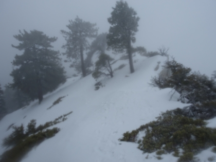 Traversing below the ridge. Slipping to one side would be a wild ride but survivable, going over the ridge to the other side is bye-bye.