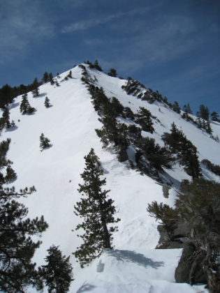 It always pains me to include this picture, because it has absolutely none of the real life impact of seeing this slope in person. This is an insanely steep section of trail. Imagine hiking something close to the Half Dome cables without the cables. Now imagine doing it in the snow.