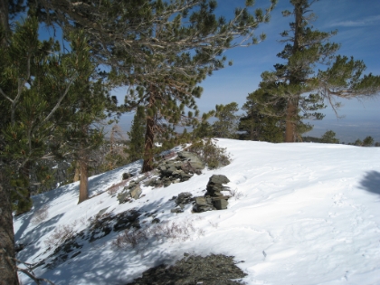 Made it to the top of Pine Mtn. The rock walls of the backpacker's tent spots are starting to show through the snow. Last time I was here, they were completely covered. Or maybe I never passed this exact spot last time? I am never quite sure without having a trail to follow. This is as far as I made it on my first snow trip up here. And I'm still about a half hour ahead of where I was on that day.