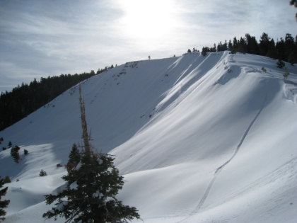 One of my favorite spots along the trail. This is supposed to be the place to spot bighorn sheep in the summer. You can see the snowshoe tracks going right along the ridge. Looks fun, but my route goes a different direction.