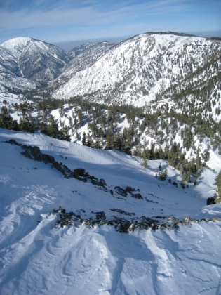 One wrong step and you will be sliding a long, long ways down. Might be fun on skiis, but would make for a really bad day right now.