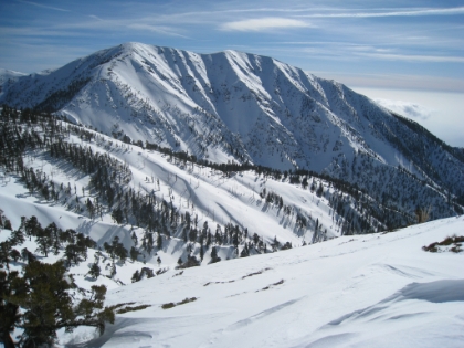 A look East from my summit for the day at a particularly snowy peak whose name I do not know.