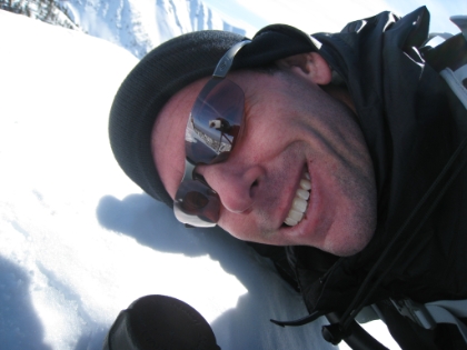 Posing at the summit marker.