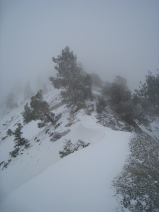 Even though the trail is invisible, it's tough to get lost here. Just follow the ridge. But it is getting really cold. The thermometer is hovering between 15 and 18 degrees and with the wind chill, I wouldn't be surprised if it's sub zero.
